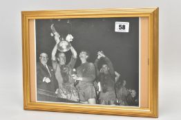 BOBBY CHARLTON, a signed photograph of Sir Bobby Charlton holding aloft the European Cup after the