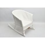 A CHILDS LLOYD LOOM TYPE WHITE OVERPAINTED MUSICAL ROCKING CHAIR, height 44cm x width 44cm x depth