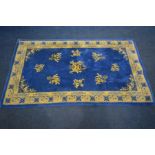 A CHINESE BLUE AND CREAM RUG, 217cm x 120cm