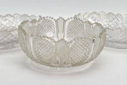 THREE CUT GLASS BOWLS, in matching cut designs, the round bowl being 23cm diameter and 10cm high,