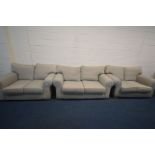 A MULTIYORK OATMEAL UPHOLSTERED THREE PIECE LOUNGE SUITE, comprising a large two seater settee,