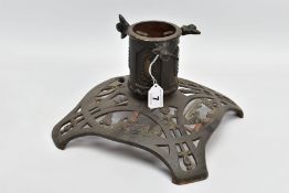 A VINTAGE CAST IRON CHRISTMAS TREE HOLDER STAND, having pierced and decorated base of childrens