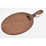 A ROBERT 'MOUSEMAN' THOMPSON OAK CHEESE BOARD, dark oak oiled finish, oval form, length 36.5cm