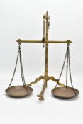 A LATE 19TH/EARLY 20TH CENTURY BRASS WEIGHING SCALES ON TRIPOD BASE, with pans imprinted D.E.