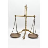 A LATE 19TH/EARLY 20TH CENTURY BRASS WEIGHING SCALES ON TRIPOD BASE, with pans imprinted D.E.