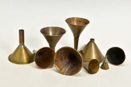 EIGHT ANTIQUE BRASS POWDER FUNNELS, of varying sizes