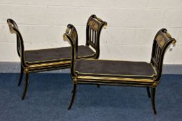 A PAIR OF REGENCY EBONISED, RED LINED AND GILT WINDOW SEATS, the outward scrolled ends with carved