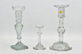 TWO GEORGE III CUT GLASS CANDLESTICKS AND A TAPER STICK, the two candlesticks both with removable