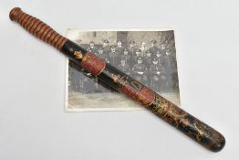 A VICTORIAN TURNED AND PAINTED WOODEN TRUNCHEON, ebonised and polychrome decorated with VR over