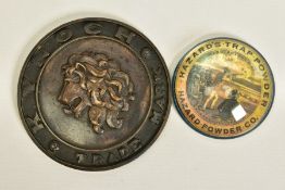 A BRASS PLAQUE OF KYNOCH'S TRADE MARK, 5 1/8'' diameter and an advert for Hazards Trap Powder U.S.A.