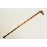 AN ANTIQUE OBSOLETE CALIBRE 9.1MM X 40R CENTRE FIRE CALIBRE WALKING CANE, fitted with a high quality