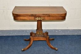 A REGENCY ROSEWOOD AND BRASS INLAID FOLD OVER CARD TABLE, the shaped rectangular top with rounded