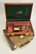 A CASED PARKER HALE 12 BORE GUN CLEANING KIT, appears to have had little/no use but the cleaner