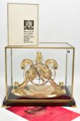 AN EMPEROR CLOCK COMPANY BRASS EPICYCLIC CLOCK UNDER RECTANGULAR GLAZED CASE, with wooden base,