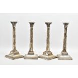 A SET OF FOUR LATE VICTORIAN SILVER CANDLESTICKS, in the Neo-Classical style, each with a