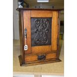 AN EDWARDIAN OAK ARTS AND CRAFTS STYLE RECTANGULAR SMOKERS CABINET, the cabinet is locked and sold