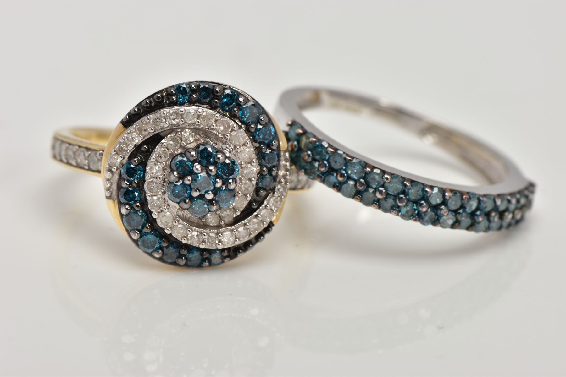 TWO 9CT GOLD DIAMOND RINGS, the first a brilliant cut treated blue diamond and single cut diamond
