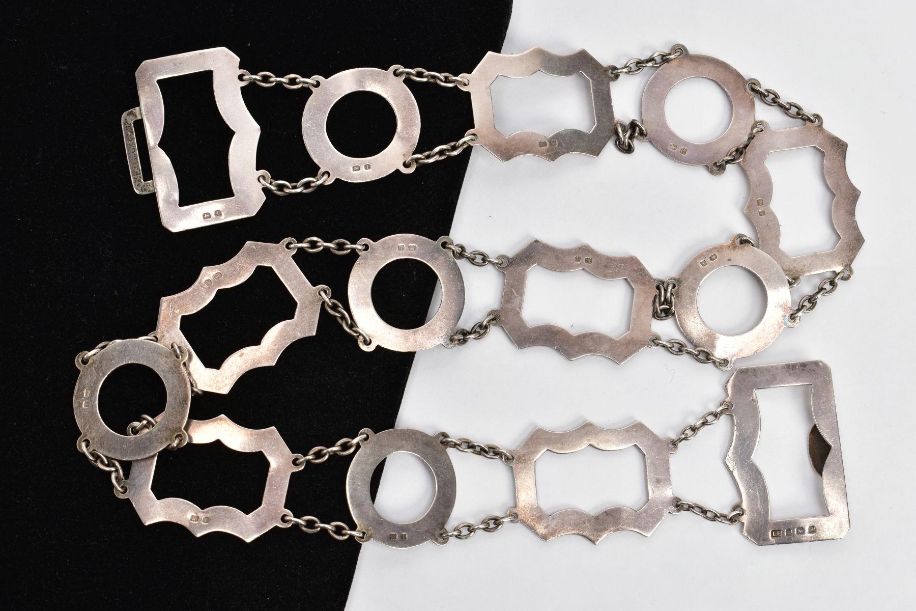 A SILVER OPENWORK BELT, designed with openwork circular and wavy links, each interspaced with curb - Image 2 of 3