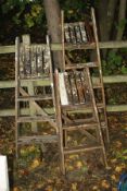 THREE WOODEN STEP LADDERS, heights 148cm, 133cm and 104cm respectively (3)