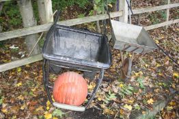 A METAL FRAMED PLASTIC WHEEL BARROW with a plastic ball wheel together with another metal wheel