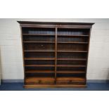 A REPRODUCTION GEORGIAN STYLE MAHOGANY TWIN DIVISION OPEN BOOKCASE, with twelve adjustable shelves