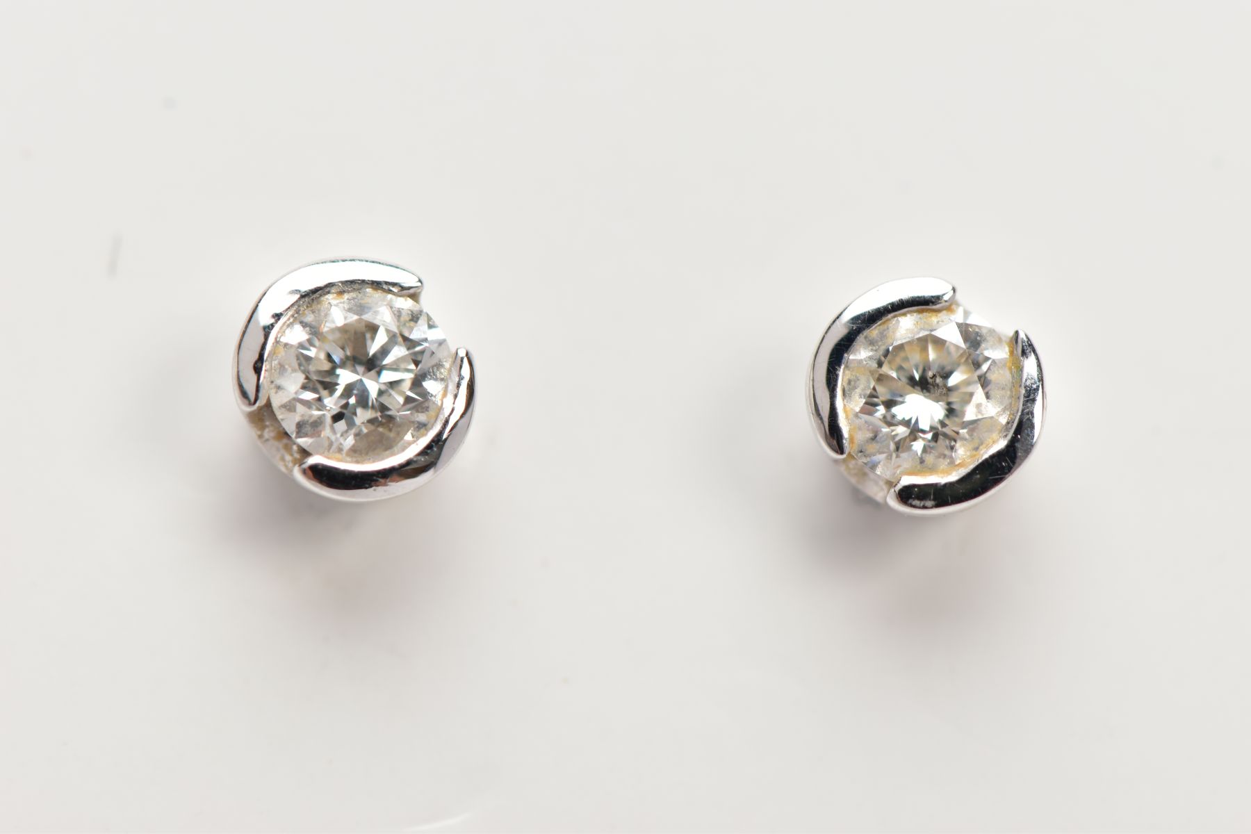 A PAIR OF 18CT GOLD DIAMOND STUD EARRINGS, each set with a single round brilliant cut diamond, total - Image 2 of 2