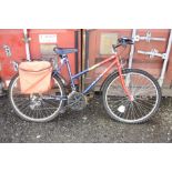 A BLUE AND RED HAWK TRAKATAK LADIES BICYCLE with Shimano gears and 19 inch frame