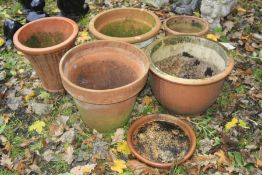 A COLLECTION OF SIX TERRECOTA PLANTERS, the largest diameter 39cm x height 37cm (some cracks)