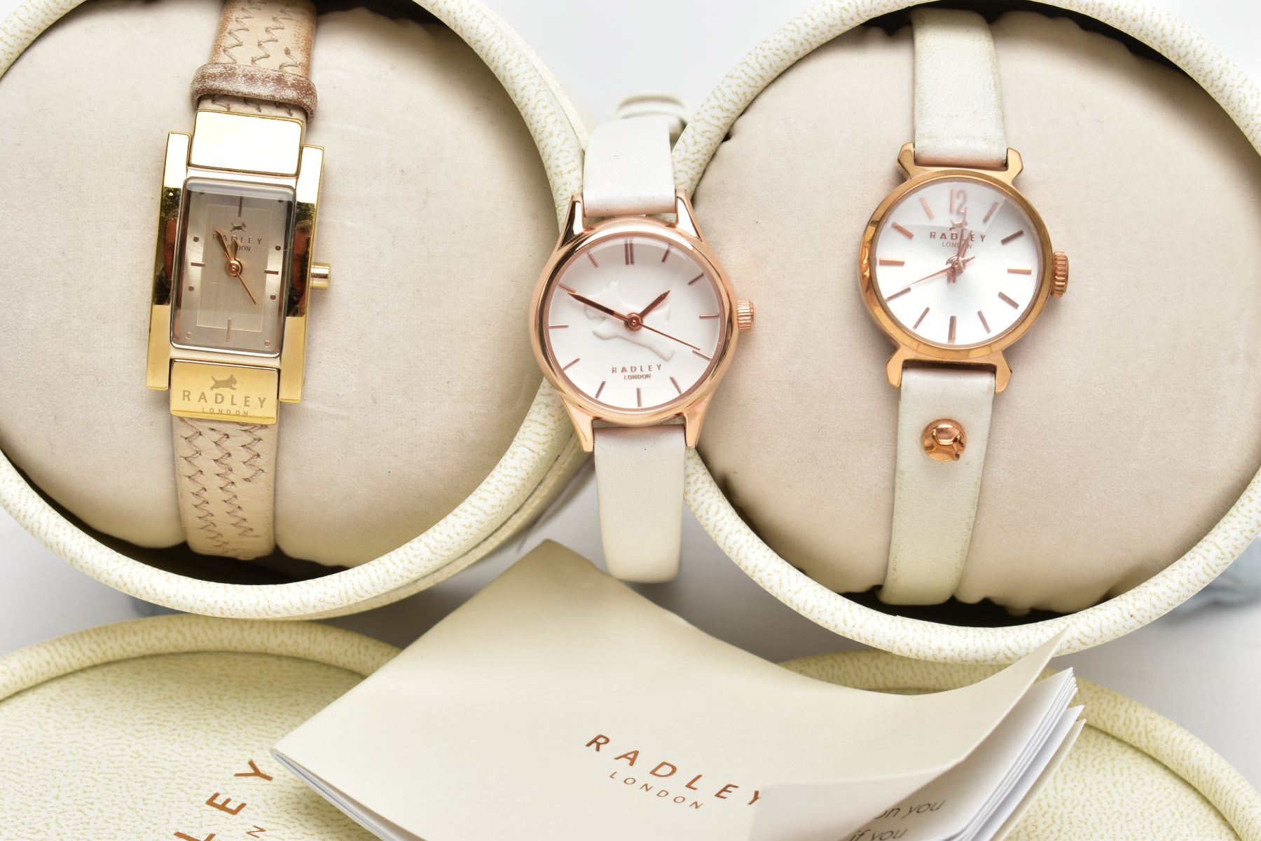 A SELECTION OF RADLEY WATCHES, one white and rose gold coloured watch, white watch face featuring