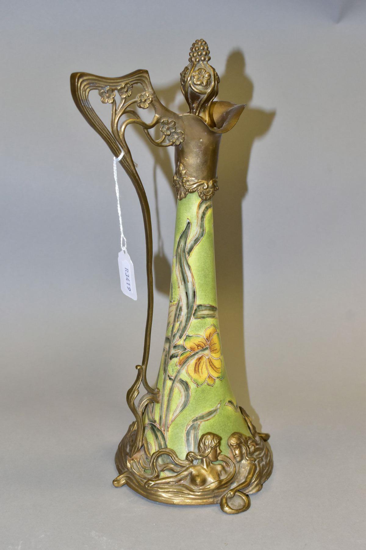 A REPRODUCTION ART NOUVEAU STYLE BRASS MOUNTED CERAMIC EWER, with foliate stopper, the wavy lip with - Image 3 of 7