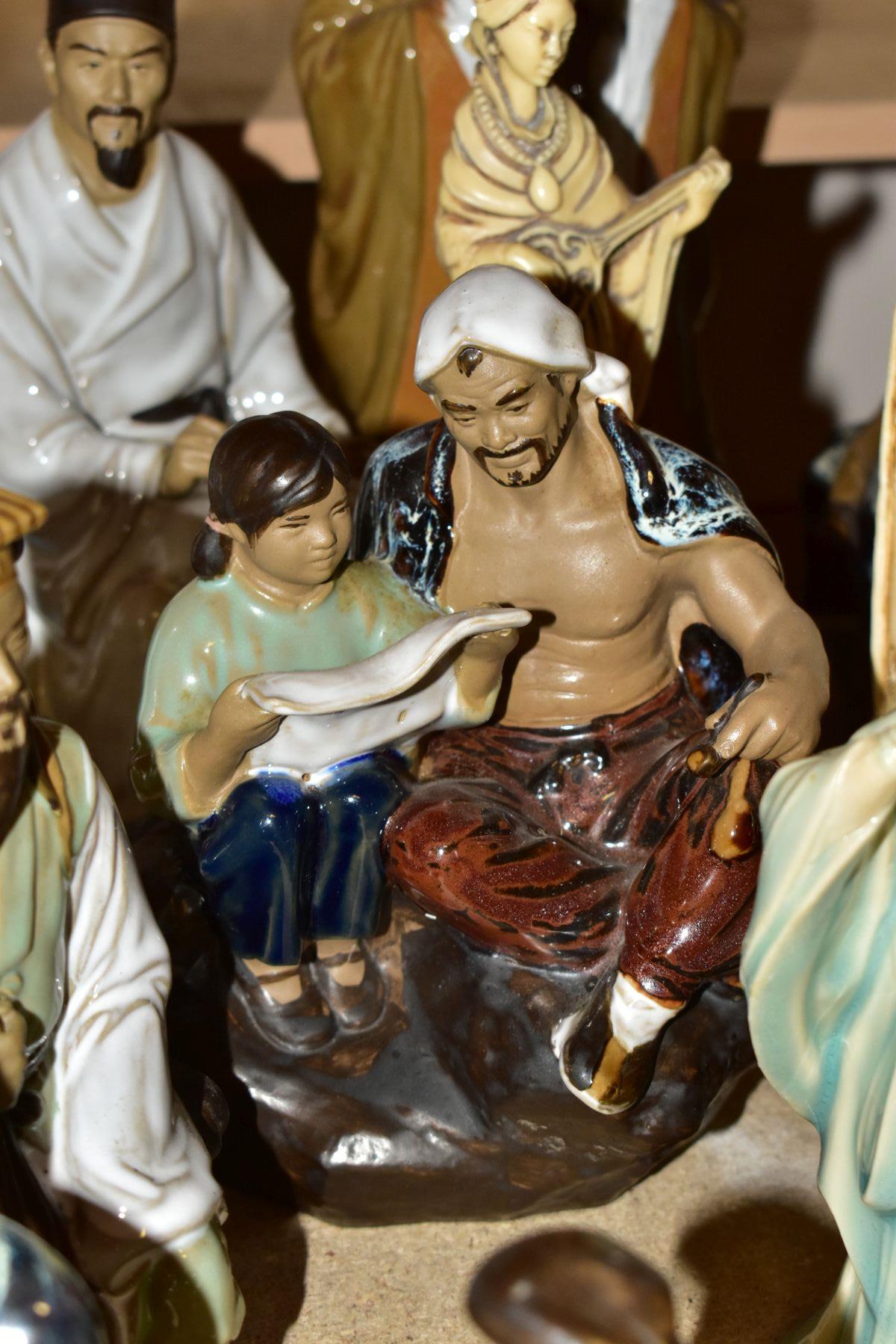 A GROUP OF MODERN ORIENTAL FIGURINES, to include fifteen figurines featuring people reading, fishing - Image 9 of 12