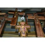 TEN ASSORTED WOODEN CRUCIFIXES AND A WOODEN WALL HANGING, Holy water ' Souvenir', the crucifixes are
