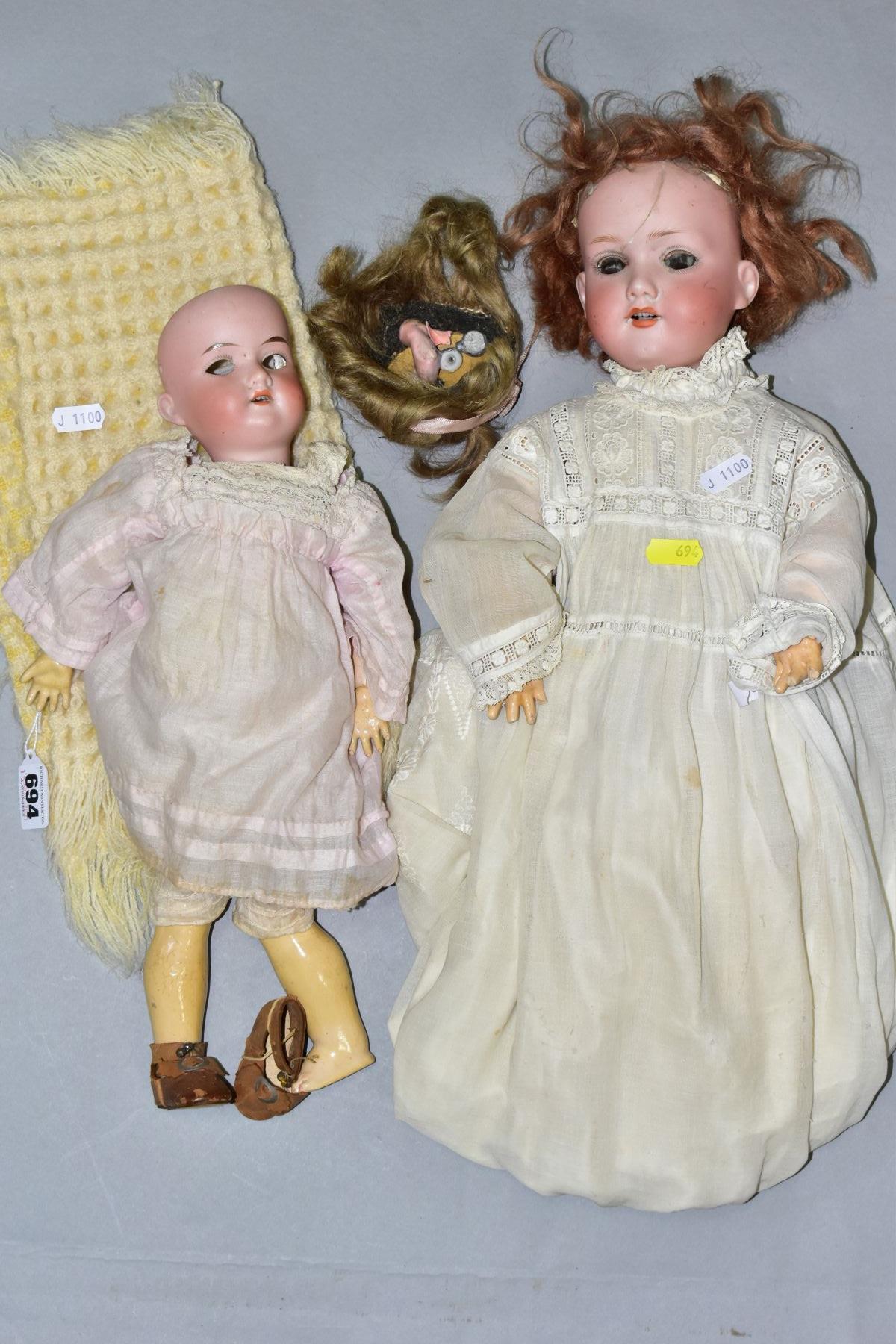 TWO ARMAND MARSEILLE BISQUE HEAD DOLLS, larger one has nape of neck marked 'Armand Marseille,