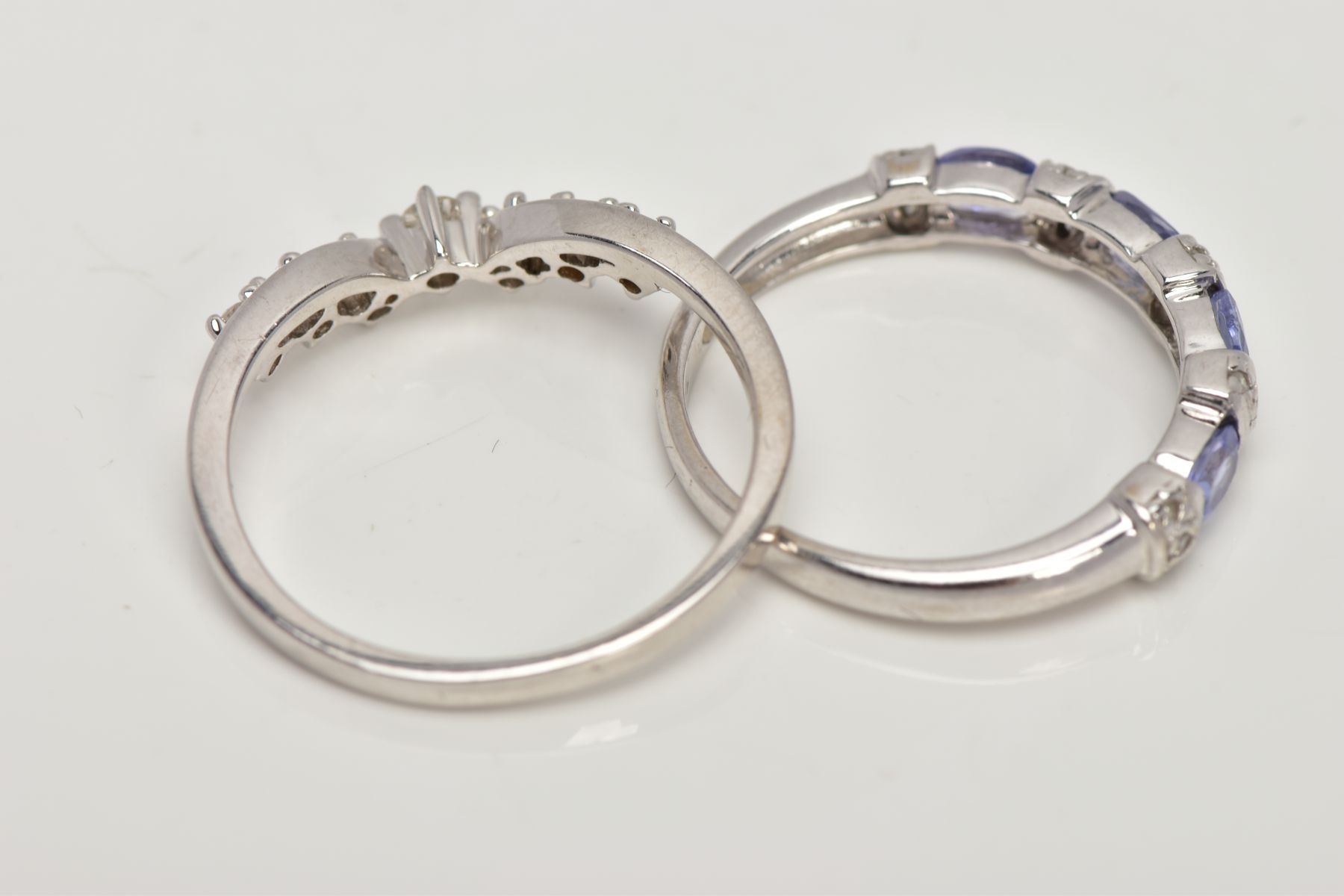 TWO GEM SET RINGS, the first a 9ct white gold diamond dress ring, of a slightly V-shape design, claw - Image 3 of 3