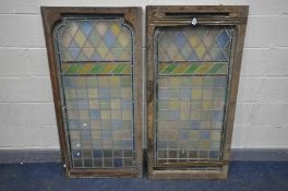 A PAIR OF 19TH CENTURY PINE FRAMED LEAD GLAZED COLOURED WINDOWS, 137cm x 67cm (condition:-one