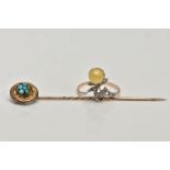 A YELLOW METAL TURQUOISE STICK PIN AND A YELLOW METAL RING, the stick pin of a circular design set