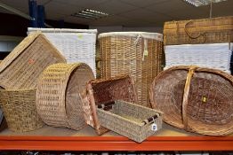 TWELVE LARGE WICKER BASKETS AND HAMPERS, ETC, to include two lined laundry hampers, one with lid,