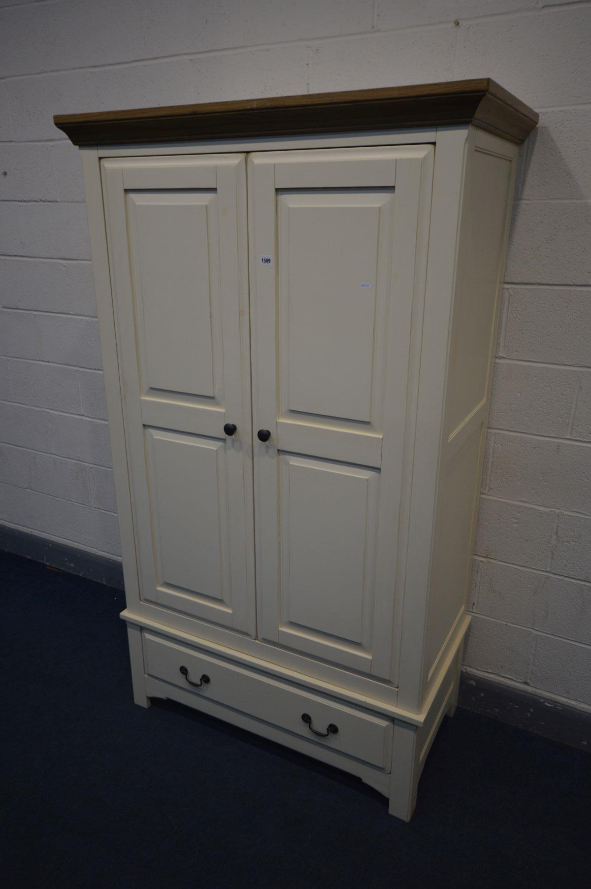AN OAK AND PARTIALLY PAINTED CREAM DOUBLE DOOR WARDROBE with a single drawer, width 114cm x depth - Image 3 of 4