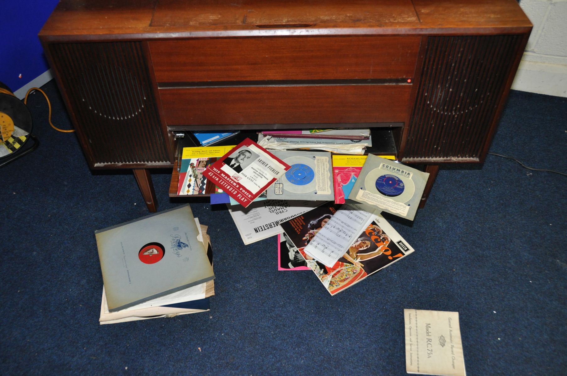 A BUSH SRG142 VINTAGE RADIOGRAM in a teak case fitted with a Garrard 2025 turntable (PAT fail due to