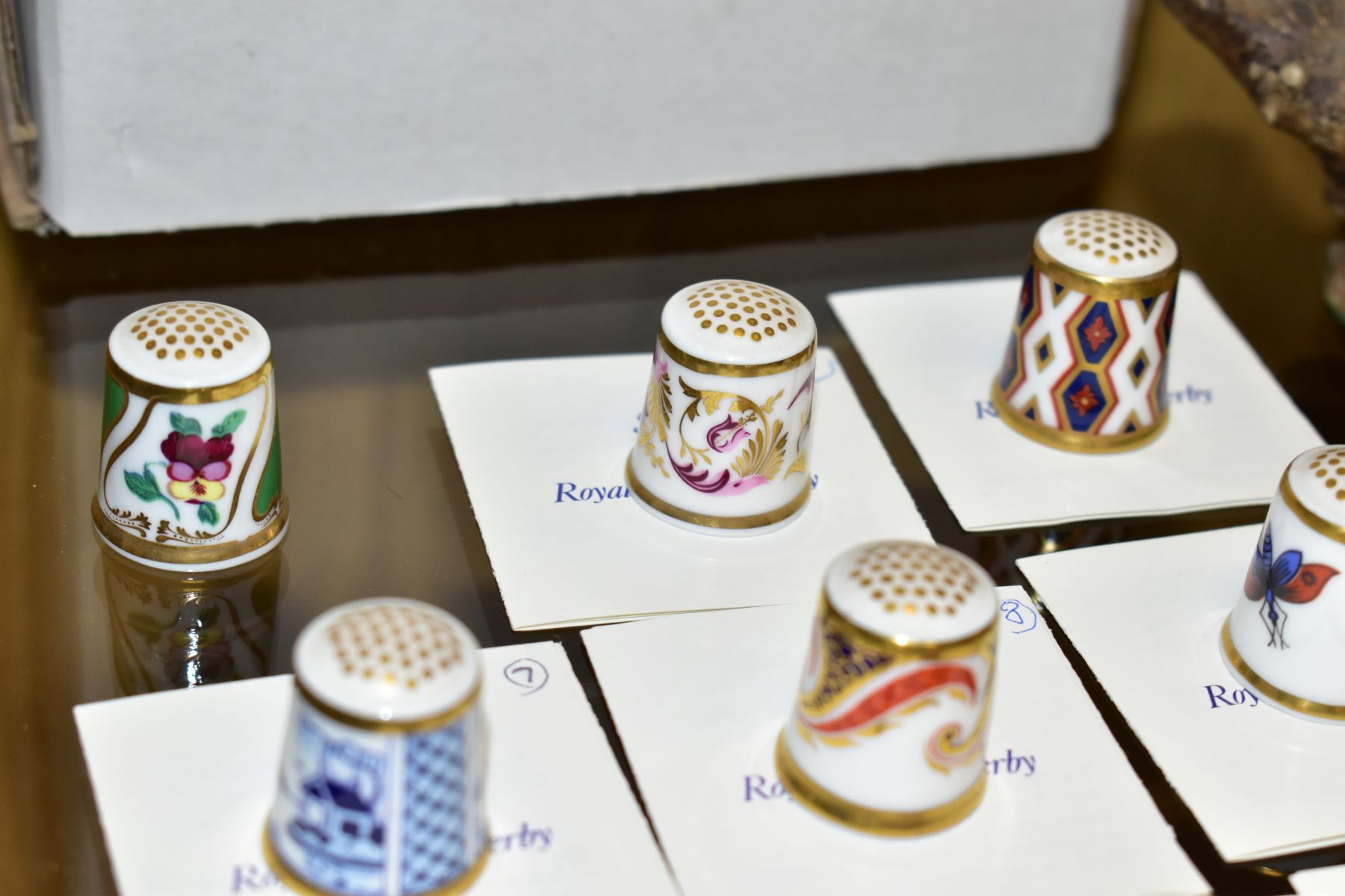 A COLLECTION OF TWENTY ONE ROYAL CROWN CHINA THIMBLES, including a selection from The Historical - Image 5 of 6