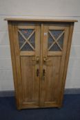 A 20TH CENTURY PINE PANNELED AND GLAZED TWO DOOR CUPBOARD, width 85cm x depth 40cm x height 149cm (