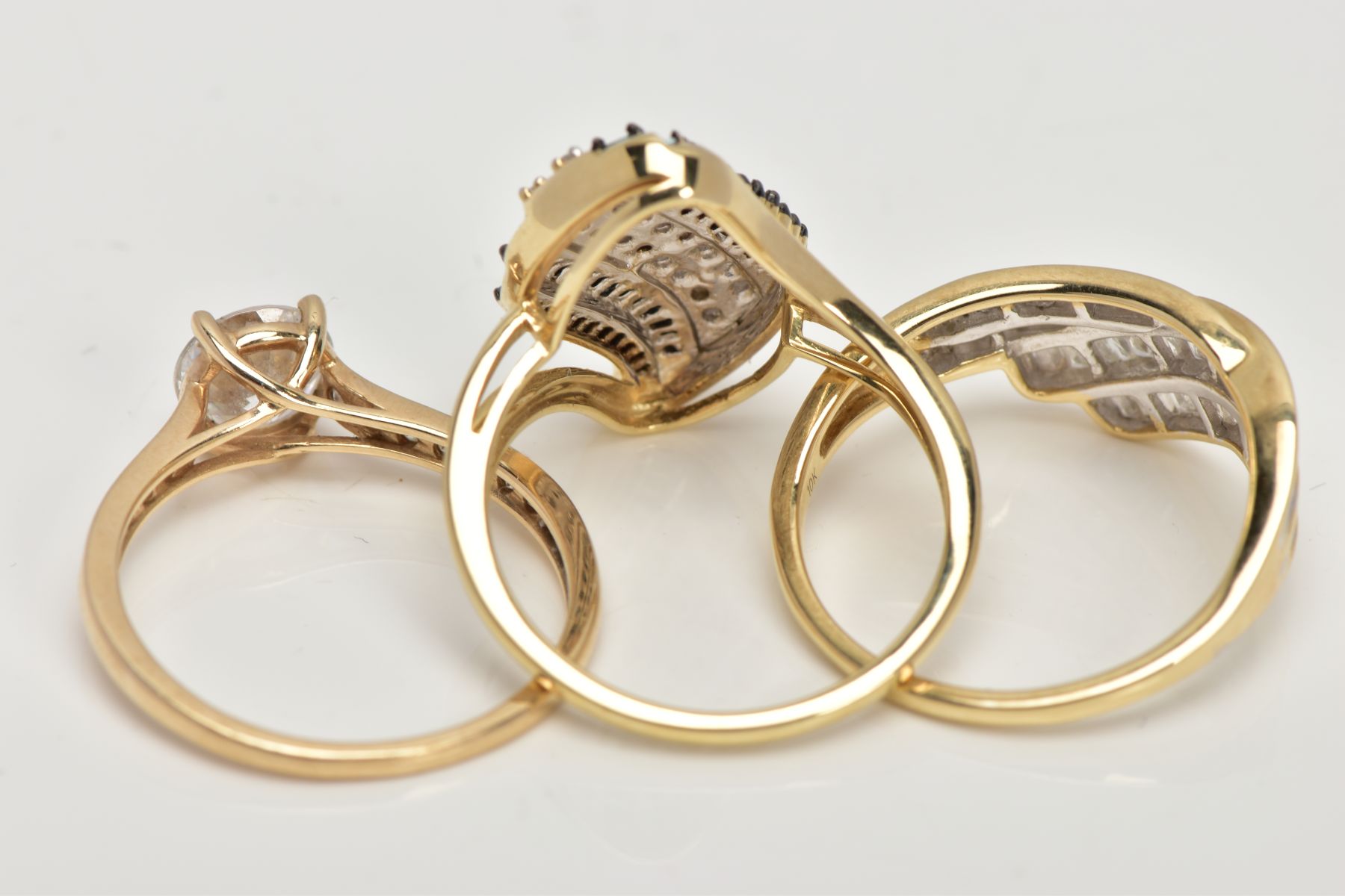 THREE 9CT GOLD GEM SET RINGS, the first of cross over design set with baguette cut diamonds, total - Image 3 of 3