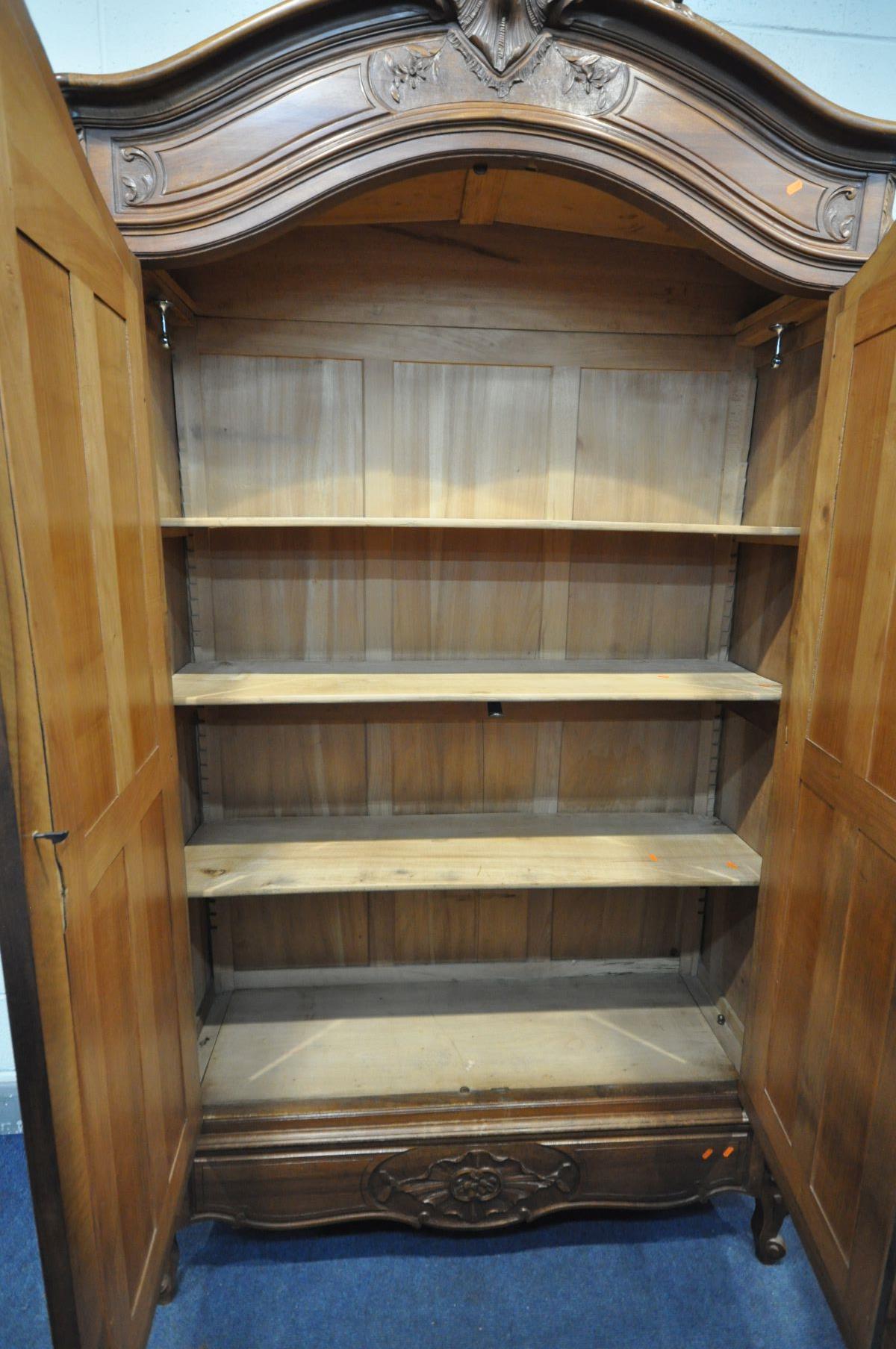 A FRENCH HARDWOOD ARMOIRE, with double bevelled edge mirror doors, enclosing three adjustable - Image 5 of 5