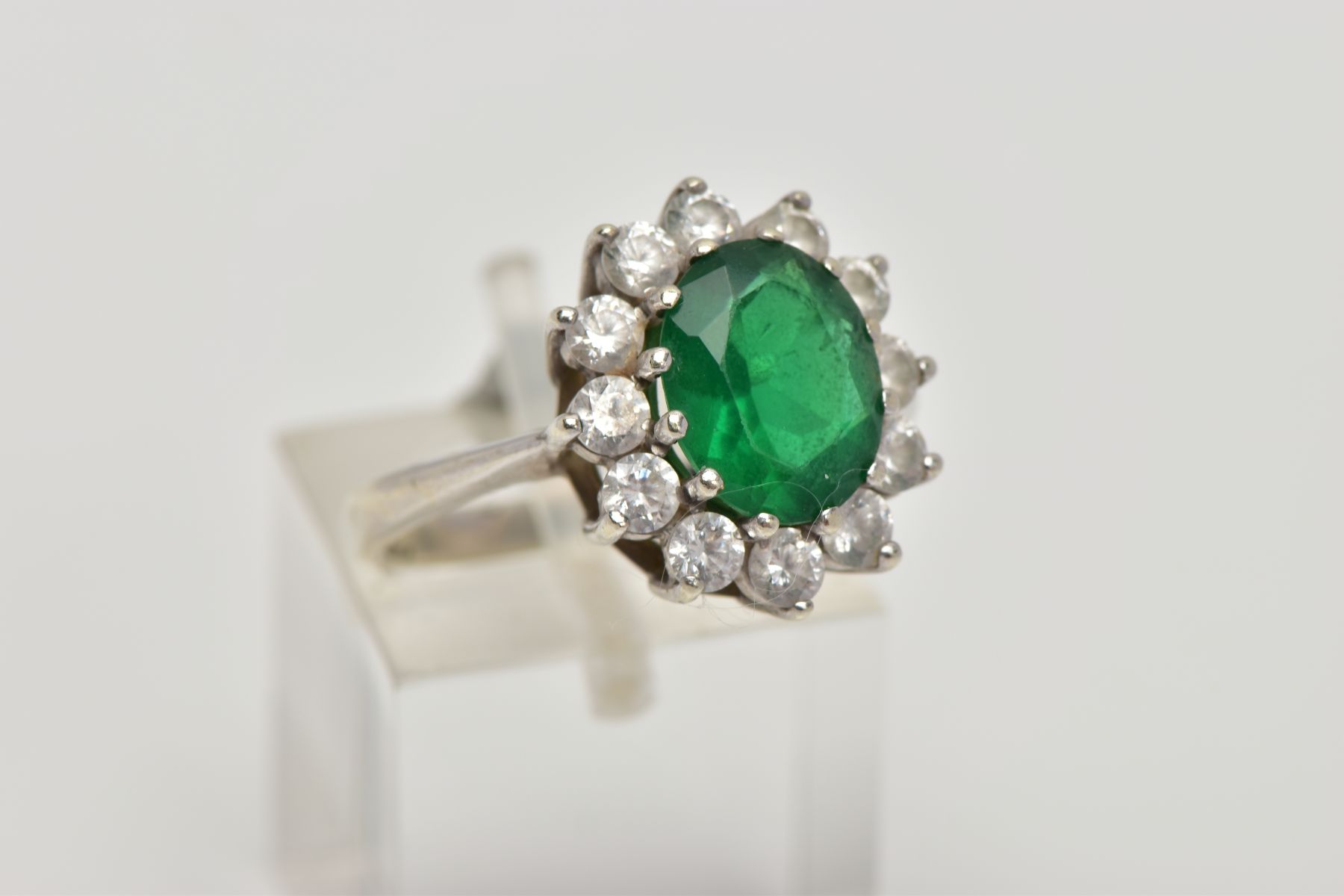 A 9CT WHITE GOLD CLUSTER RING, designed with a central green stone assessed as paste, within a - Image 4 of 5