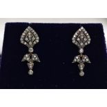 A PAIR OF YELLOW METAL DIAMOND DROP EARRINGS, each of an art deco style set with a small round