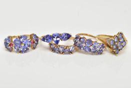 FIVE 9CT GOLD TANZANITE RINGS, to include a three stone tanzanite ring, pear shaped, one stone