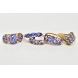 FIVE 9CT GOLD TANZANITE RINGS, to include a three stone tanzanite ring, pear shaped, one stone