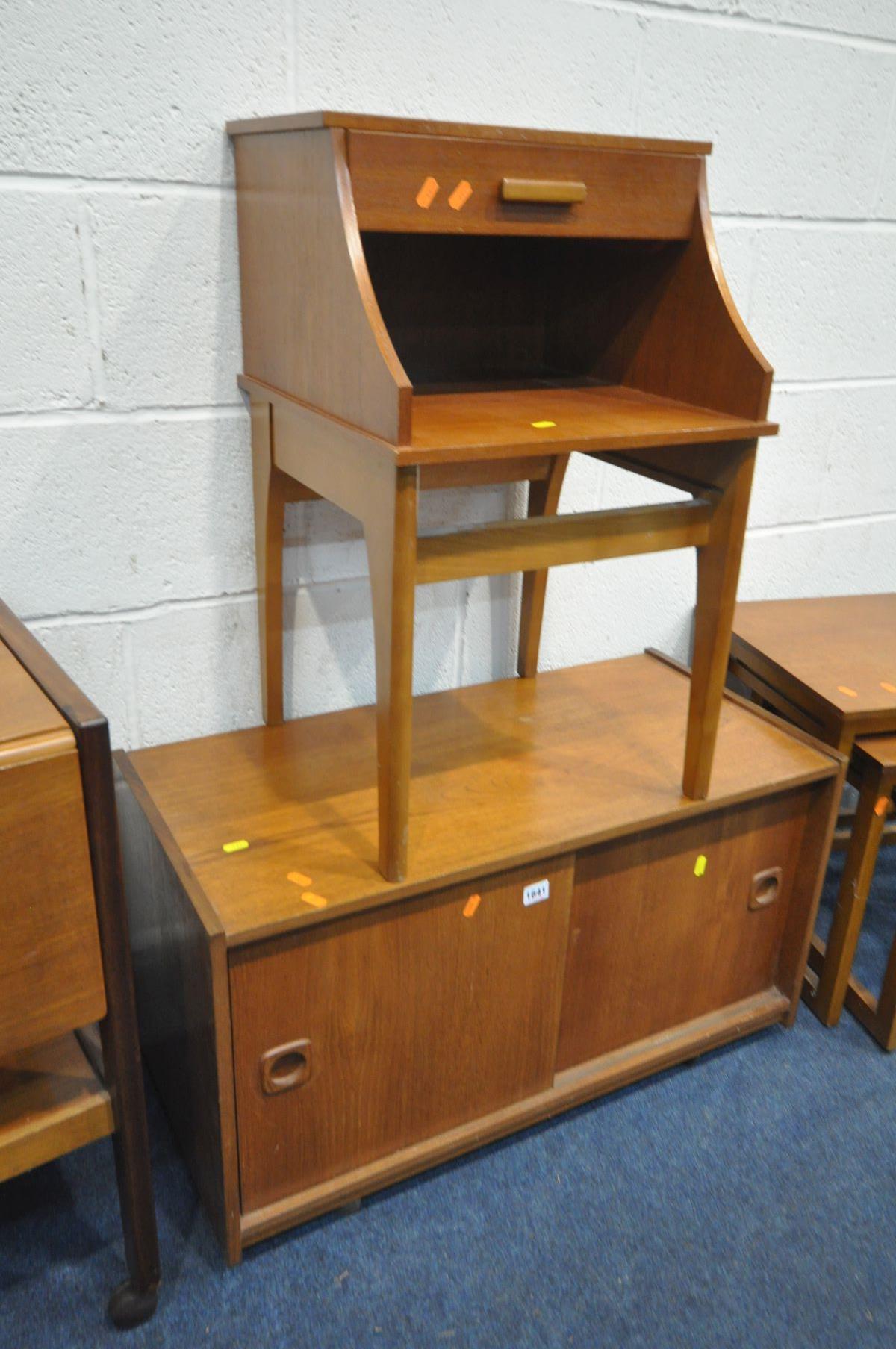 FOUR VARIOUS MID CENTURY TEAK OCCASIONAL FURNITURE, to include a sliding two door cabinet, telephone - Image 2 of 4