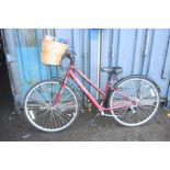 A BURGANDY APOLLO CX.10 LADIES BICYCLE, with grip shift max gears, basket to front and 15 inch
