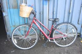 A BURGANDY APOLLO CX.10 LADIES BICYCLE, with grip shift max gears, basket to front and 15 inch